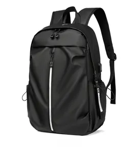 Detail of waterproof black business backpack featuring vertical silver zipper and USB port