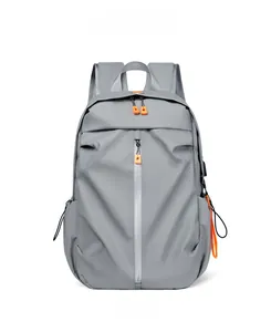 Detailed front view of gray business laptop backpack with orange zipper accents