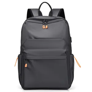 Waterproof dark grey casual backpack with orange zipper accents and padded straps