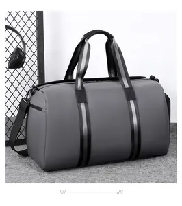 Macro detail of waterproof dark grey duffel bag with woven straps and side zipper pocket