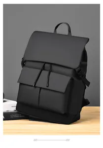 Detail of waterproof black lattice backpack showing flap pockets and side buckle closure