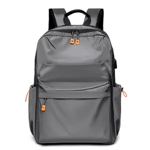 Zaino porta PC grigio minimalista impermeabile con porta USB e zip multistrato