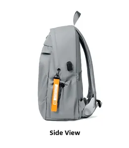 Side view of gray travel backpack with USB port and orange fashion ribbon strap