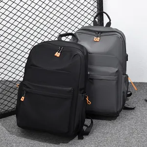 Fashionable waterproof nylon backpacks in black and grey with orange zippers for school