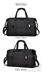 Macro shot of waterproof black travel bag showing front zipper and adjustable strap