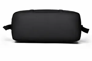 Flat bottom view of large black waterproof travel duffel bag with reinforced stitching