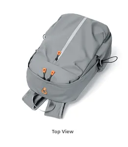 Top view of waterproof gray laptop backpack showing orange zipper details and durable fabric