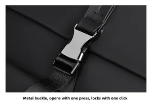 Detail of durable metal buckle and matte fabric on a black travel backpack for men