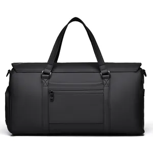 Large waterproof black travel bag for business and gym with durable handles and front pocket