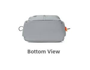 Detailed bottom view of gray multifunctional backpack showing waterproof fabric and orange puller