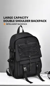 Detail view of large capacity black nylon backpack with front mesh pocket and elastic straps