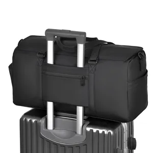 Waterproof travel duffel bag with a functional trolley sleeve mounted on a suitcase
