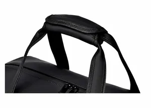 Detail of reinforced padded handle and durable two-way zippers on black travel bag