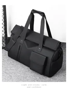 Detail view of durable black travel bag on grey carpet with textured matte finish