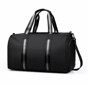 Detail view of black waterproof travel bag with striped handles and side zip compartment