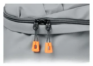 Close-up of waterproof grey backpack fabric with orange anti-slip zipper pullers