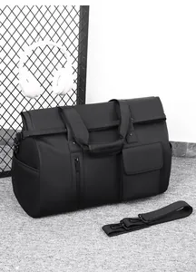 Macro view of black waterproof travel bag with detachable strap and multiple pockets