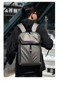 Detail of grey waterproof nylon business backpack with purple trim in urban scene