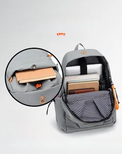 Detail of multi-compartment interior for 14-inch laptop and essentials in a grey backpack