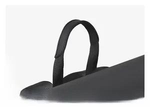 Close-up of the reinforced black padded top handle and nylon strap of the backpack