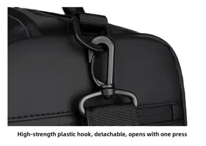 Detail of durable high-strength plastic swivel hook and nylon strap on a black travel bag