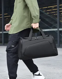 Detail of high-density waterproof nylon fabric and reinforced handles on black travel bag