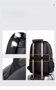 Detail view of breathable honeycomb straps and luggage trolley sleeve on black backpack
