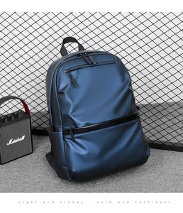 Detailed close-up of blue water-resistant nylon backpack with metallic finish and zippers