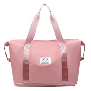 Bolso de viaje rosa de gran capacidad impermeable con compartimento para zapatos