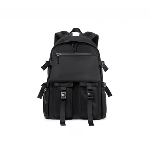 Front detail of black nylon backpack featuring flap closure and dual buckle cargo pockets