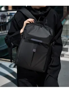 Close-up of waterproof matte black nylon backpack with urban functional buckles and straps