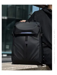 Outdoor shot of a black waterproof business laptop backpack with matte nylon texture