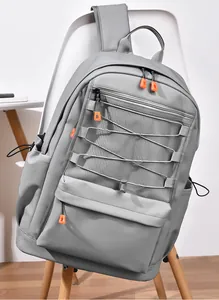 Detail of grey laptop backpack showing mesh pocket, orange zippers, and elastic drawstring
