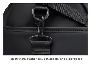Detail of durable high-strength plastic swivel hook and detachable shoulder strap on travel bag