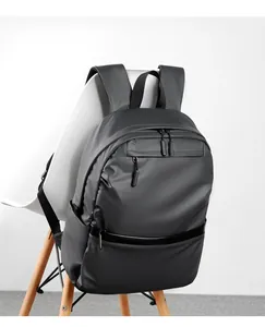 Macro detail of waterproof fabric and hidden zipper on black business laptop backpack