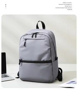 Close-up of a grey business laptop backpack featuring waterproof fabric and side pockets