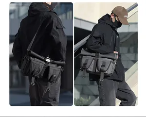 Rear and side view of large waterproof roll-top messenger bag with functional pockets