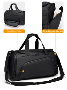 Macro view of front and side zipper pockets on this large black fitness travel bag