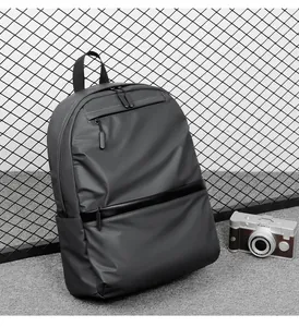 Detail view of water-resistant business backpack in dark gray with decorative zip strip