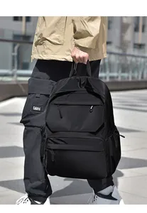 Detail of waterproof black nylon backpack with multi-zipper pockets for outdoor travel