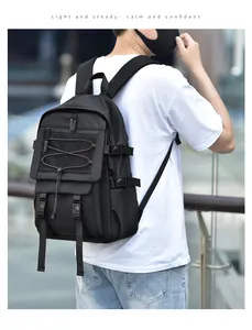 Detail view of durable black laptop backpack with mesh pockets and adjustable straps