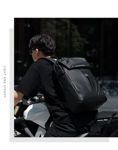 Detail of waterproof matte black motorcycle backpack with side buckles and roll-top design