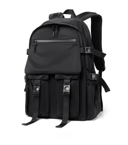 Detailed side view of black multi-pocket fashion backpack with buckle straps and water-resistant fabric