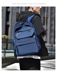 Close-up of waterproof dark blue travel backpack with multi-layer zipper pockets