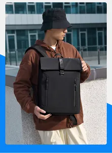 Detail of waterproof black business backpack with flip-top cover and metal buckle closure