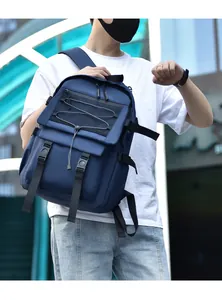 Outdoor shot of a blue high-capacity backpack with strap details and mesh pockets