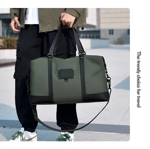 Army green water-resistant travel duffel bag with black leather base and side straps