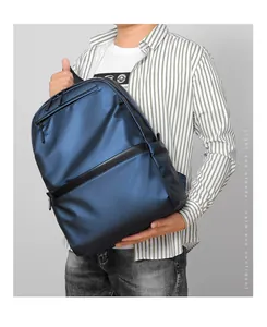 Detail of waterproof dark blue business backpack with metallic finish and black trim