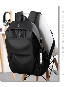 Detail view of a black multi-functional backpack with USB port and decorative straps