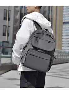 Close-up of a large capacity waterproof outdoor backpack in dark gray matte nylon